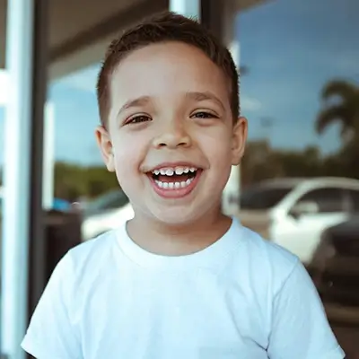 A young boy smiles